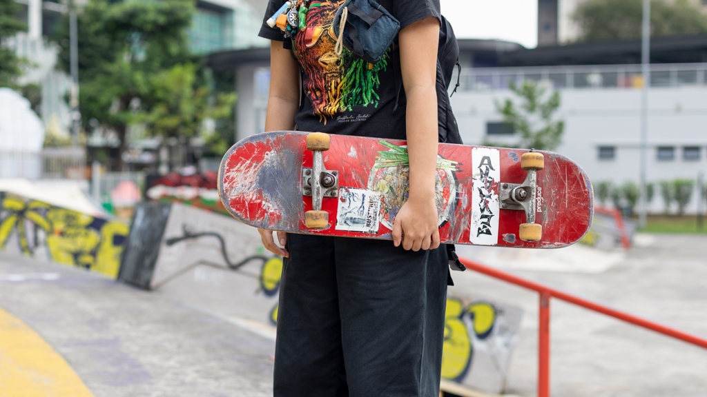 Kate-Singaporean-Student-Tee_Woofies_Warehouse-Pants_UNIQLO-Shoes_Vans-Bag_Carhartt-Skateboard_Preduce-UNIFORM-08052025-2